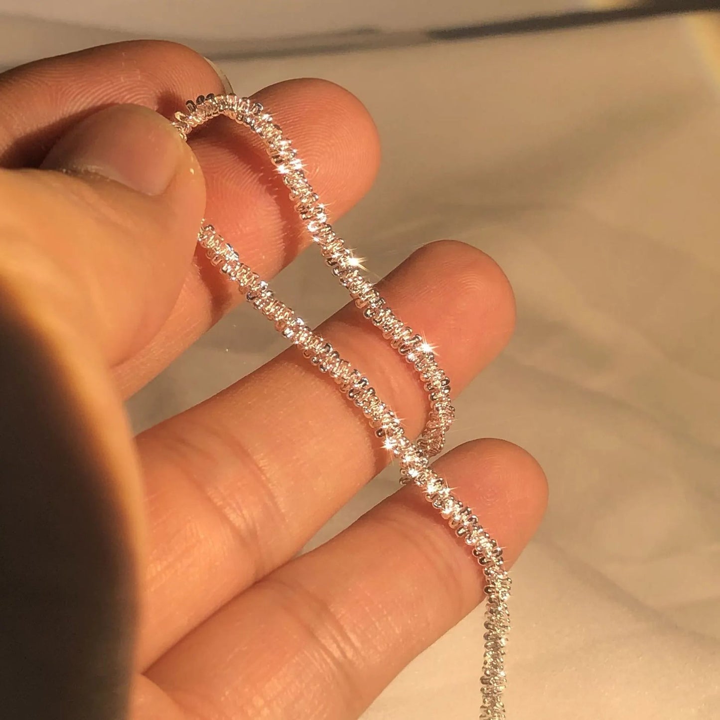 Glitrende Armbånd